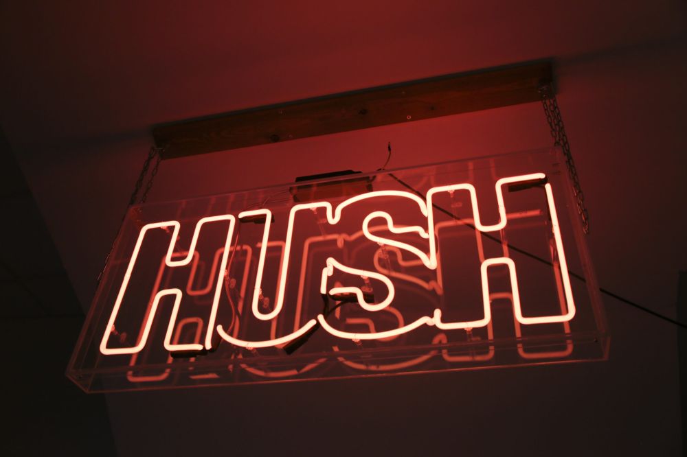Hush sign on the wall.